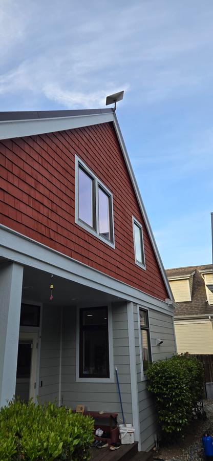 Cedar shake home with newly cleaned windows